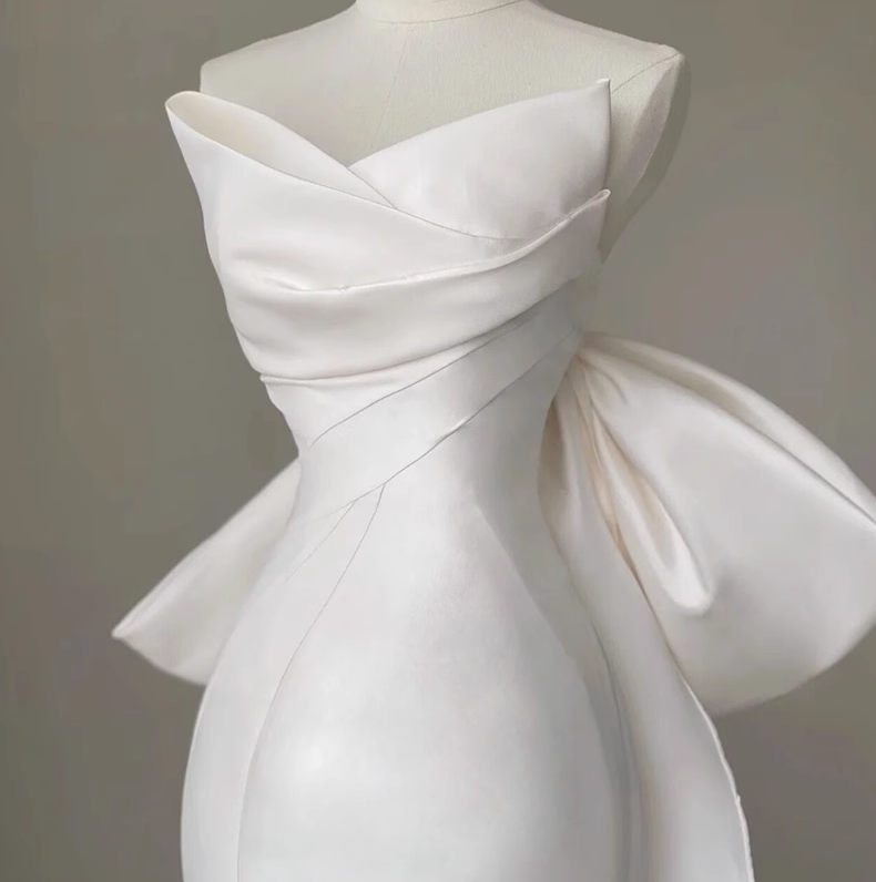 White fishtail bow cascading ruffles sleeveless floor-length elegant women's dress