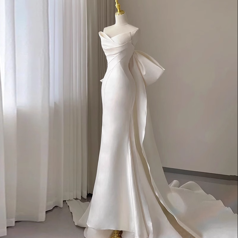 White fishtail bow cascading ruffles sleeveless floor-length elegant women's dress